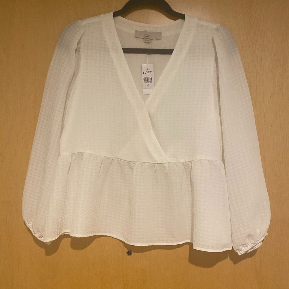 White Peplum V-neck top